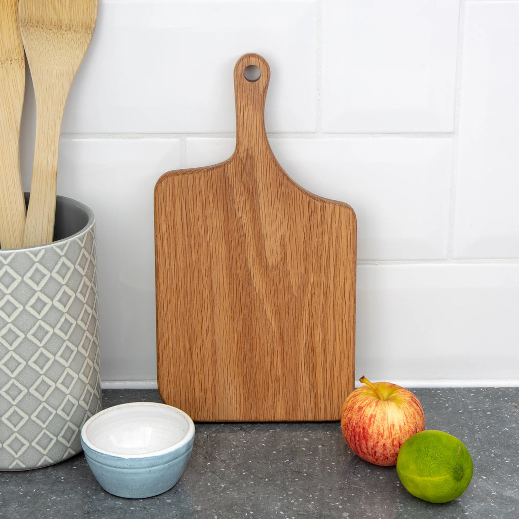 A Solid Oak Chopping Board with an Extended Handle from Dust Shack for sale at Mostyn