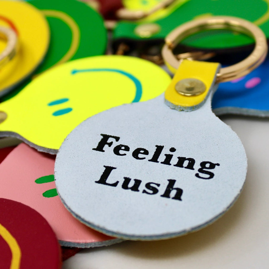 Feeling Lush Smilie Face Neon Yellow Leather Key Fob 2 from ARK Colour Design for sale at Mostyn