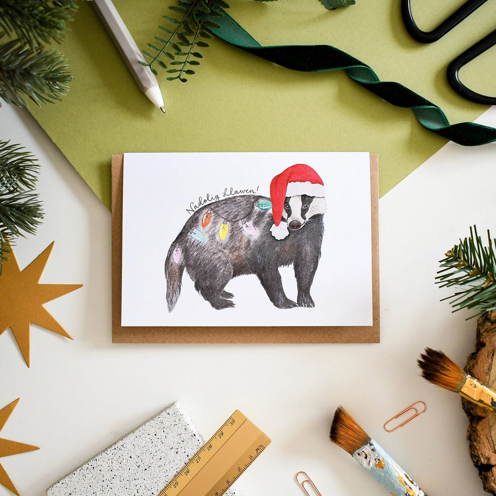Festive Badger Welsh Christmas Card from Eleri Haf Designs for sale at Mostyn