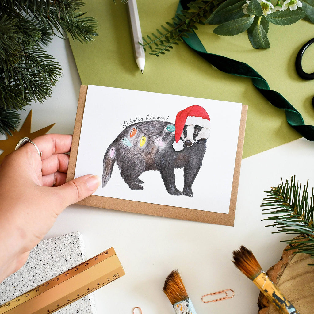 Festive Badger Welsh Christmas Card from Eleri Haf Designs for sale at Mostyn