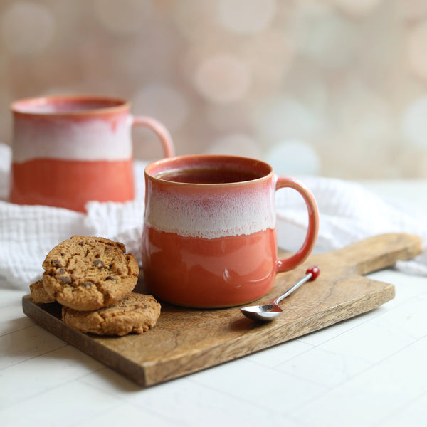 A Coral Pink Handmade Ceramic Mugster from Glosters pottery for sale at Mostyn.