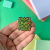 A Green Man Enamel Pin Brooch by Stacey McEvoy Caunt for sale at Mostyn 