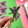 A Green Winged Devil Vinyl Sticker by Stacey McEvoy Caunt for sale at Mostyn