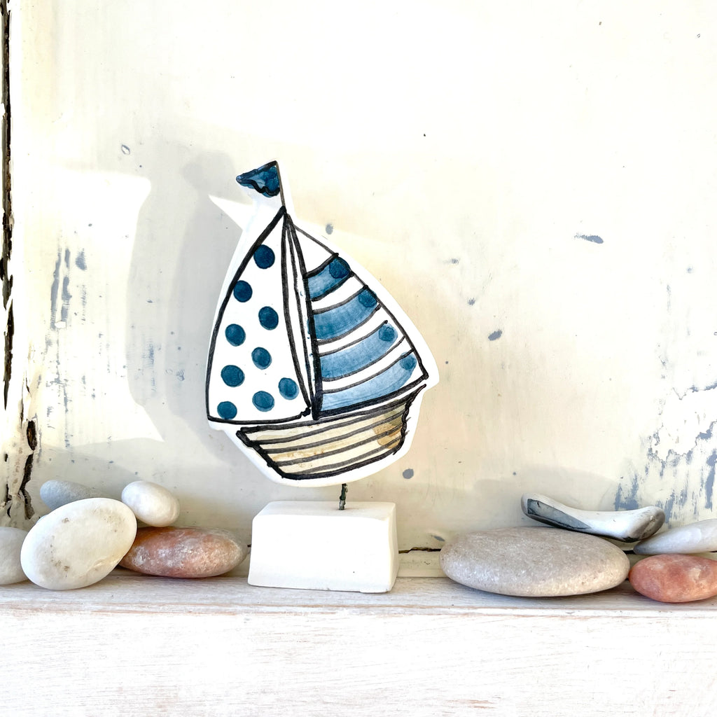 A Handcrafted Ceramic Sail Boat Ornament from Louise Crookenden Johnson for sale at Mostyn.