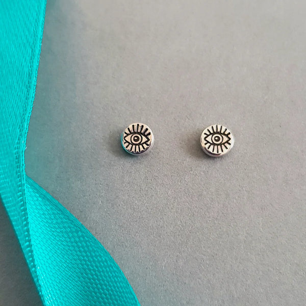 A Handcrafted Evil Eye Stamped Stud Silver Earrings from Jewellery by Jackie for sale at Mostyn.