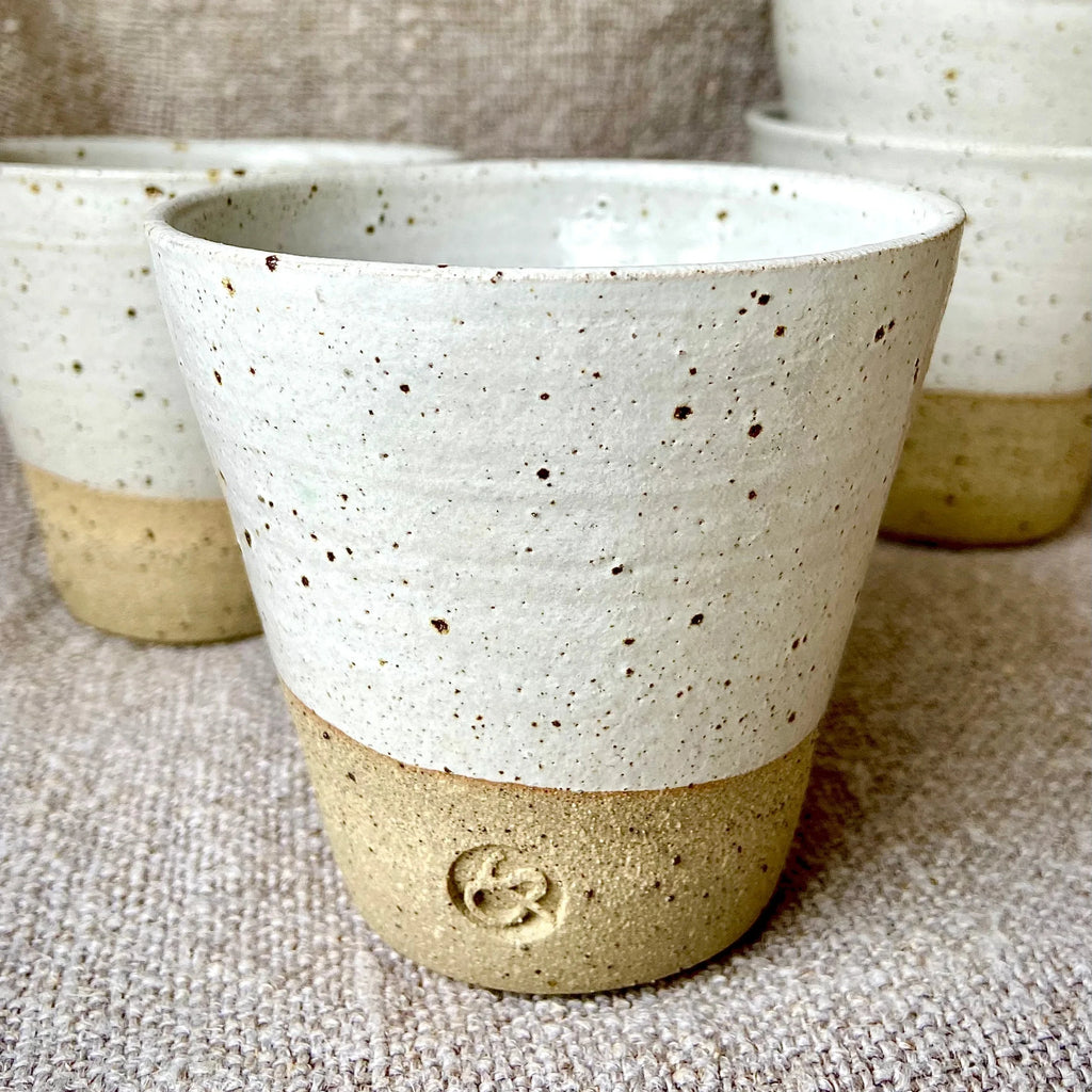 Handcrafted Flecked Ceramic Coffee Beaker with Dipped White Glaze from Sarah Bartlem for sale at Mostyn