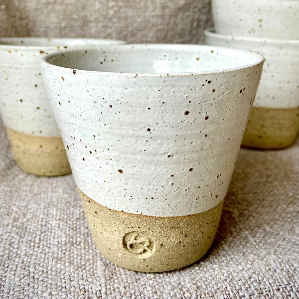 Handcrafted Flecked Ceramic Coffee Beaker with Dipped White Glaze from Sarah Bartlem for sale at Mostyn