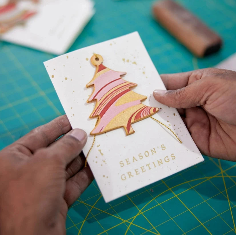 Joyful Red Christmas Tree Hand Marbled Christmas Decoration Greeting Card from Paper Mirchi for sale at Mostyn