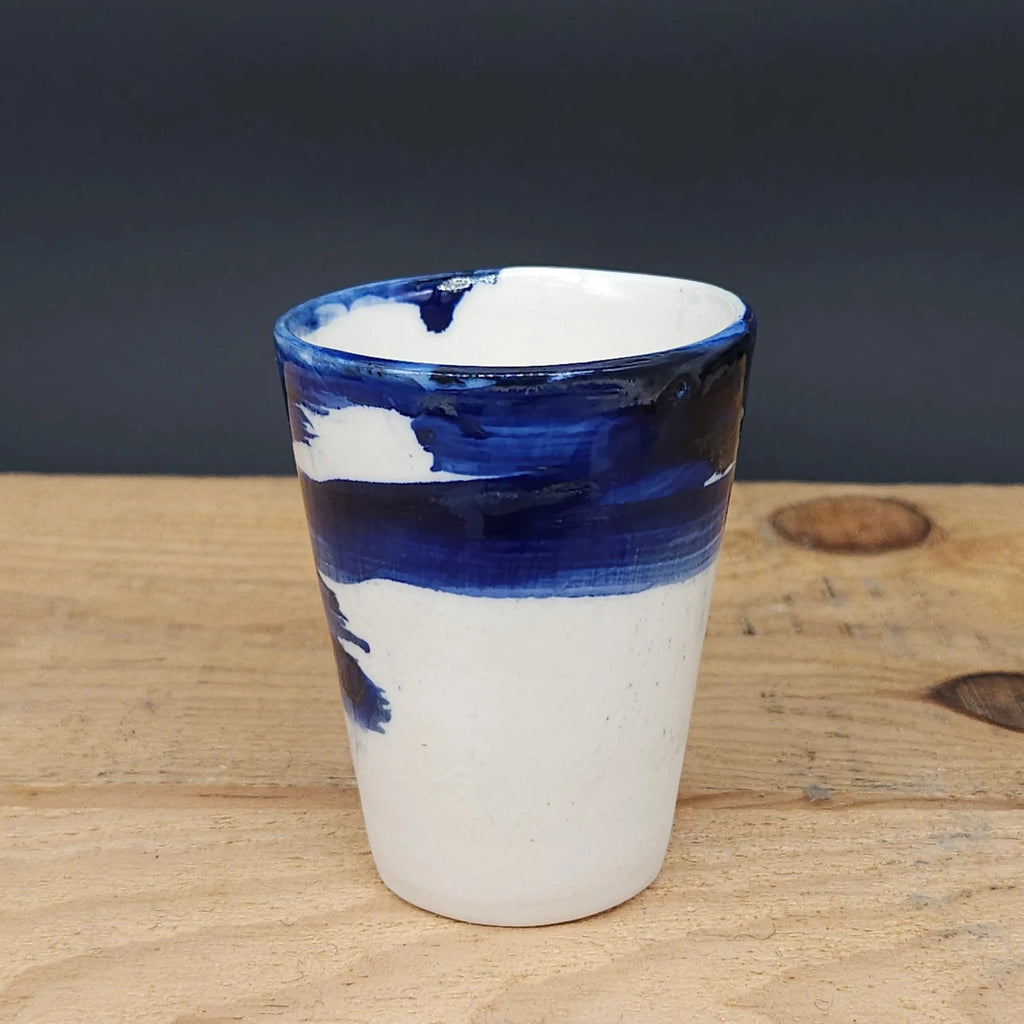 Medium Handcrafted Ceramic Cup with Blue Brushstroke from Emily Hughes for sale at Mostyn