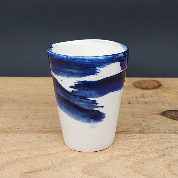 Medium Handcrafted Ceramic Cup with Blue Brushstroke from Emily Hughes for sale at Mostyn