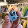 Queer all Year Enamel Badge by Sophie Green for sale at Mostyn