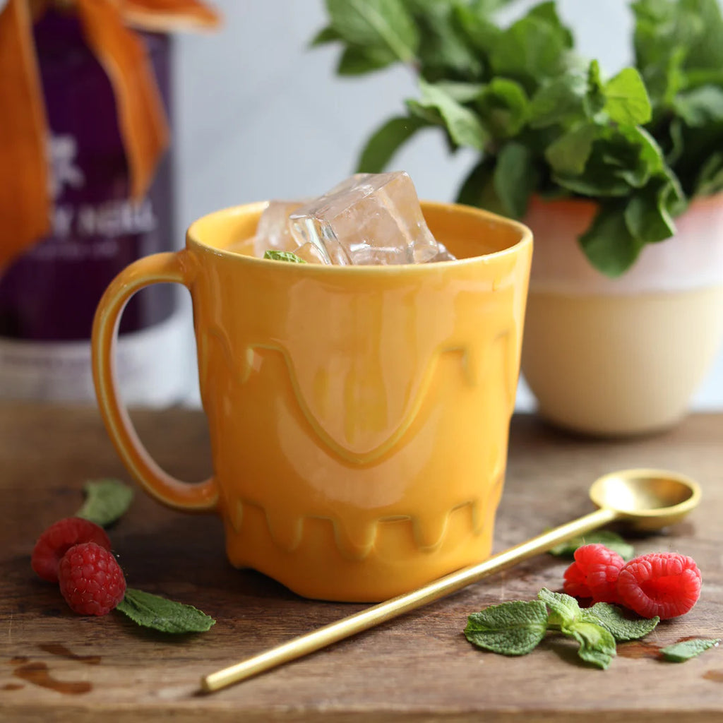 A Handmade Sandcastle Mustard Yellow Ceramic Mug from Glosters  Pottery for sale at Mostyn.