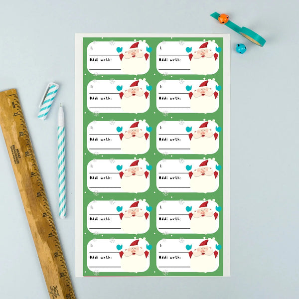 Santa Claus Welsh Language A4 Christmas Gift Tag Sticker Sheet from Oh!Susannah Welsh Gifts for sale at Mostyn