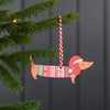 Sausage Dog Hanging Wooden Christmas Decoration from Rex London for sale at Mostyn