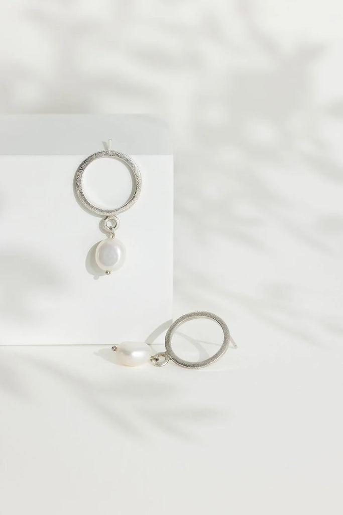 Sterling Silver Circle Stud Earrings with Drop Pearl from Rebecca Oldfield for sale at Mostyn