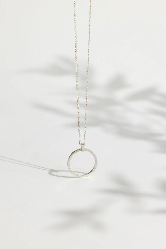 Sterling Silver Sparkle Effect Circle Necklace on an 18" Figaro Chain from Rebecca Oldfield for sale at Mostyn