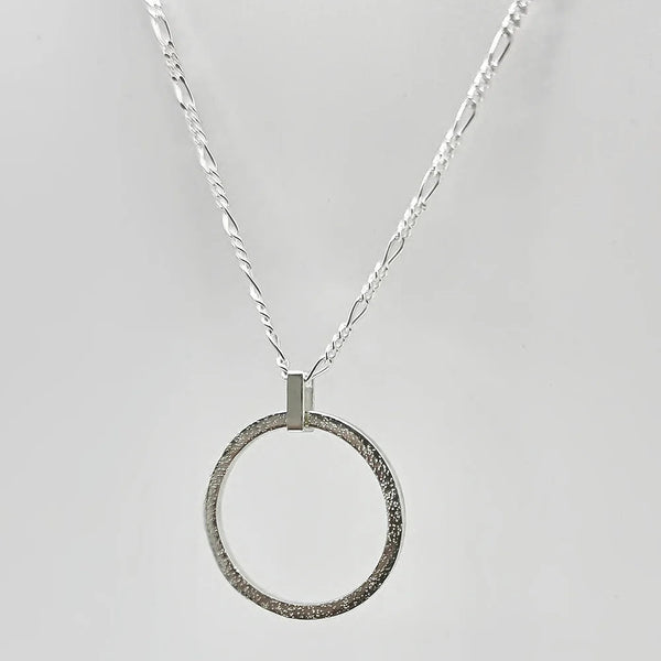 Sterling Silver Sparkle Effect Circle Necklace on an 18" Figaro Chain from Rebecca Oldfield for sale at Mostyn