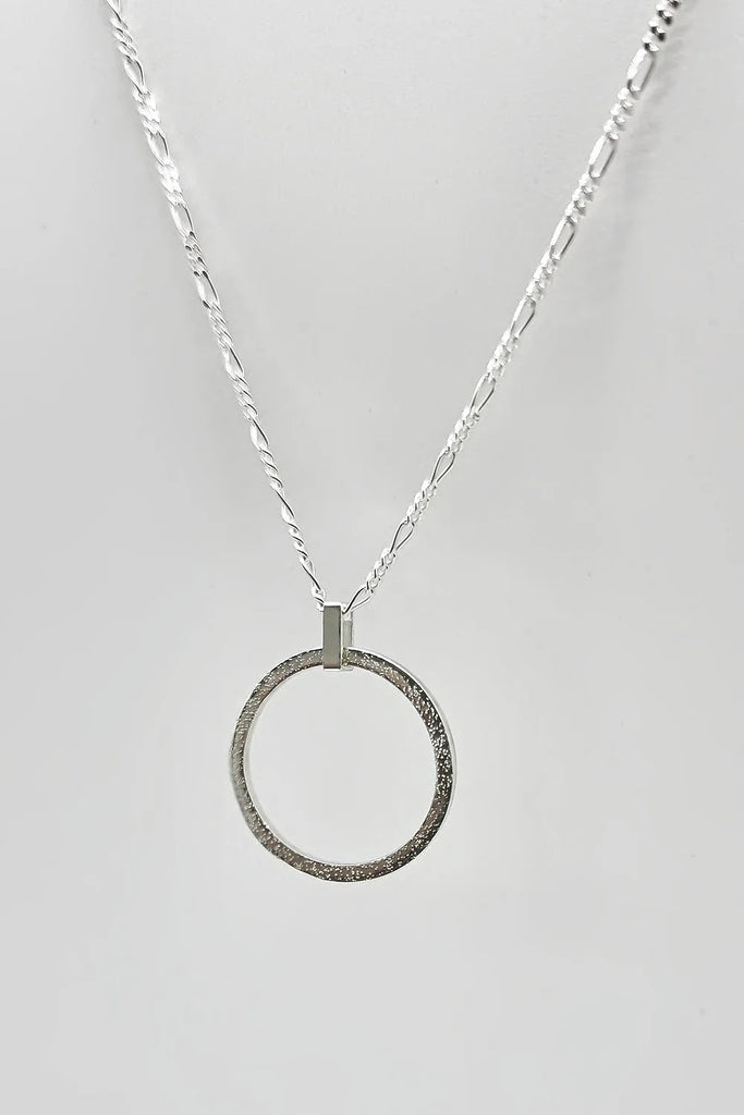 Sterling Silver Sparkle Effect Circle Necklace on an 18" Figaro Chain from Rebecca Oldfield for sale at Mostyn