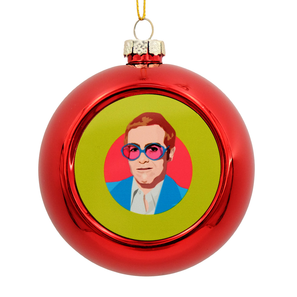 Metallic red bauble with printed disc on the front. The disc has an illustration of a young Elton John.