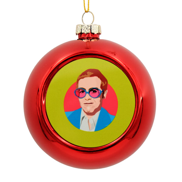 Metallic red bauble with printed disc on the front. The disc has an illustration of a young Elton John.