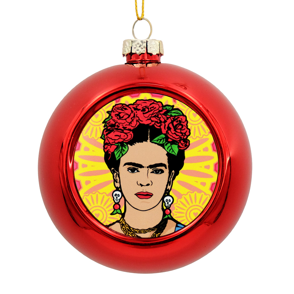 Metallic red bauble with a printed disc on the front. The disc shows an  illustration of Frida Kahlo. 