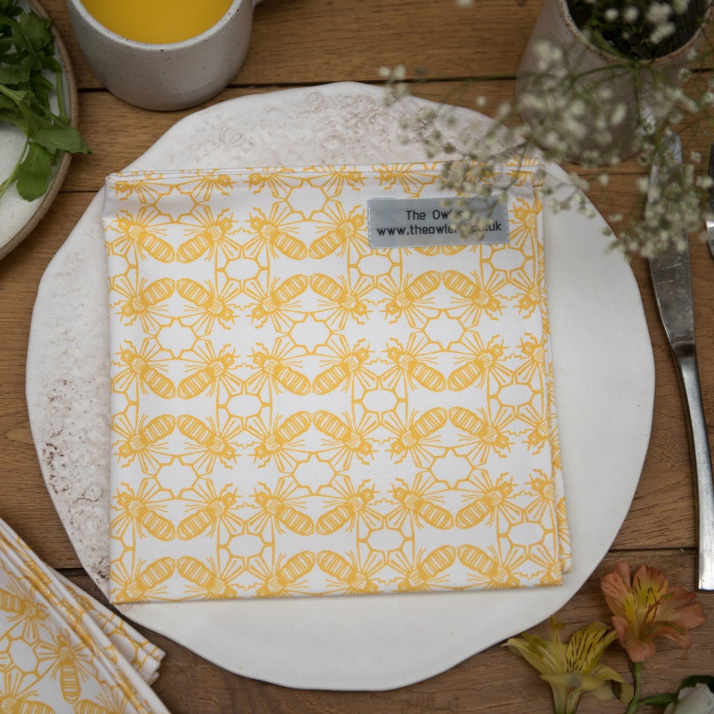 2 x Yellow and white printed fabric napkin with bee motif.