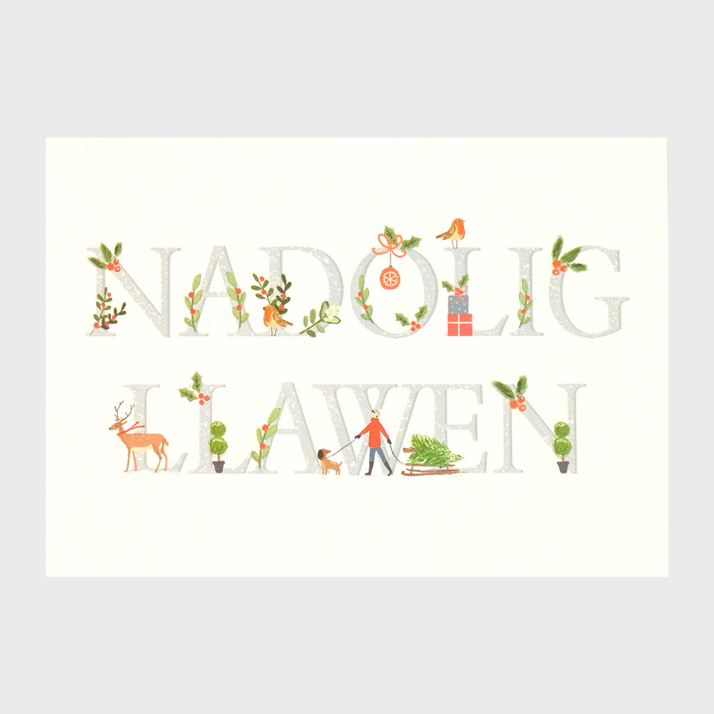 Watercolour and digital illustration on shimmering Pearlescent background.  White background with 'Nadolig Llawen' in pale grey text. There is festive foliage, robins. presents, reindeer, baubles and a person with a dog, sledge and Christmas tree, occupying the spaces in and around the lettering. 