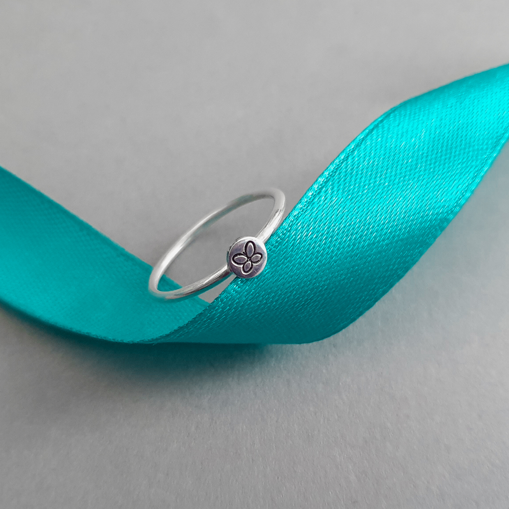 Product image with ribbon.  Sterling silver stacking ring with butterfly motif.
