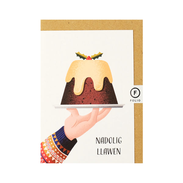 Contemporary welsh language Christmas card, designed by Cardiff based Folio. Featuring an illustration of a hand holding a plate with a full Christmas pudding with a sprig of holly on top. 