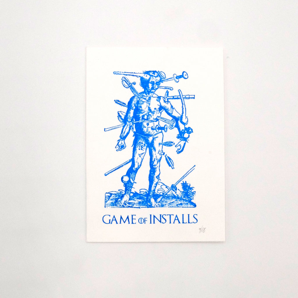 Hand printed 'Game of installs' blue and white print. Man with numerous tools stuck into his body. Made by Mark Hughes