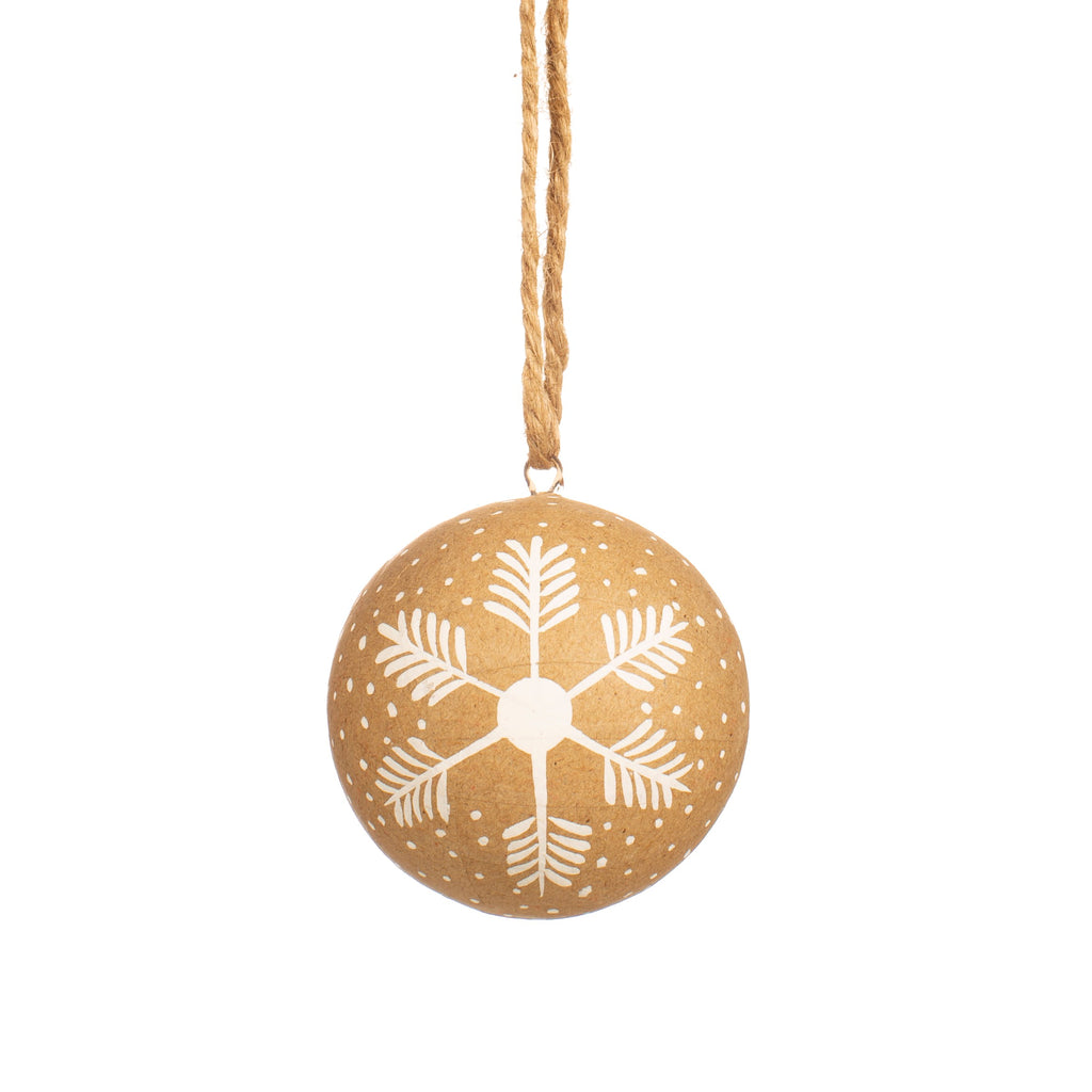 Made using papier mache this bauble features a drawn snowflake design and hangs from jute string. 