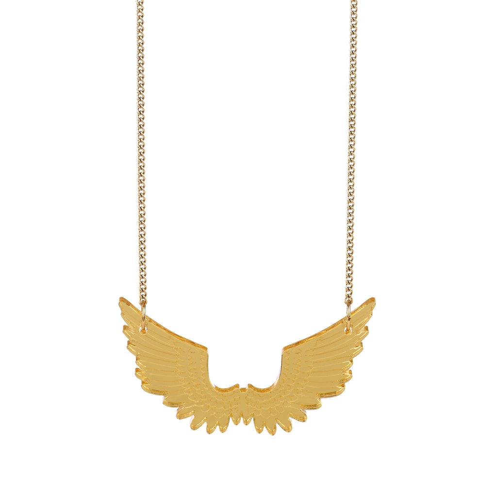 Chain necklace with a small laser-cut pair of pegasus wings, seen from the front, with scalloped wing edges. Attached to the chain at the wing tips. Reflective gold in colour with feather detail etched onto the surface.  Made by Tatty Devine.