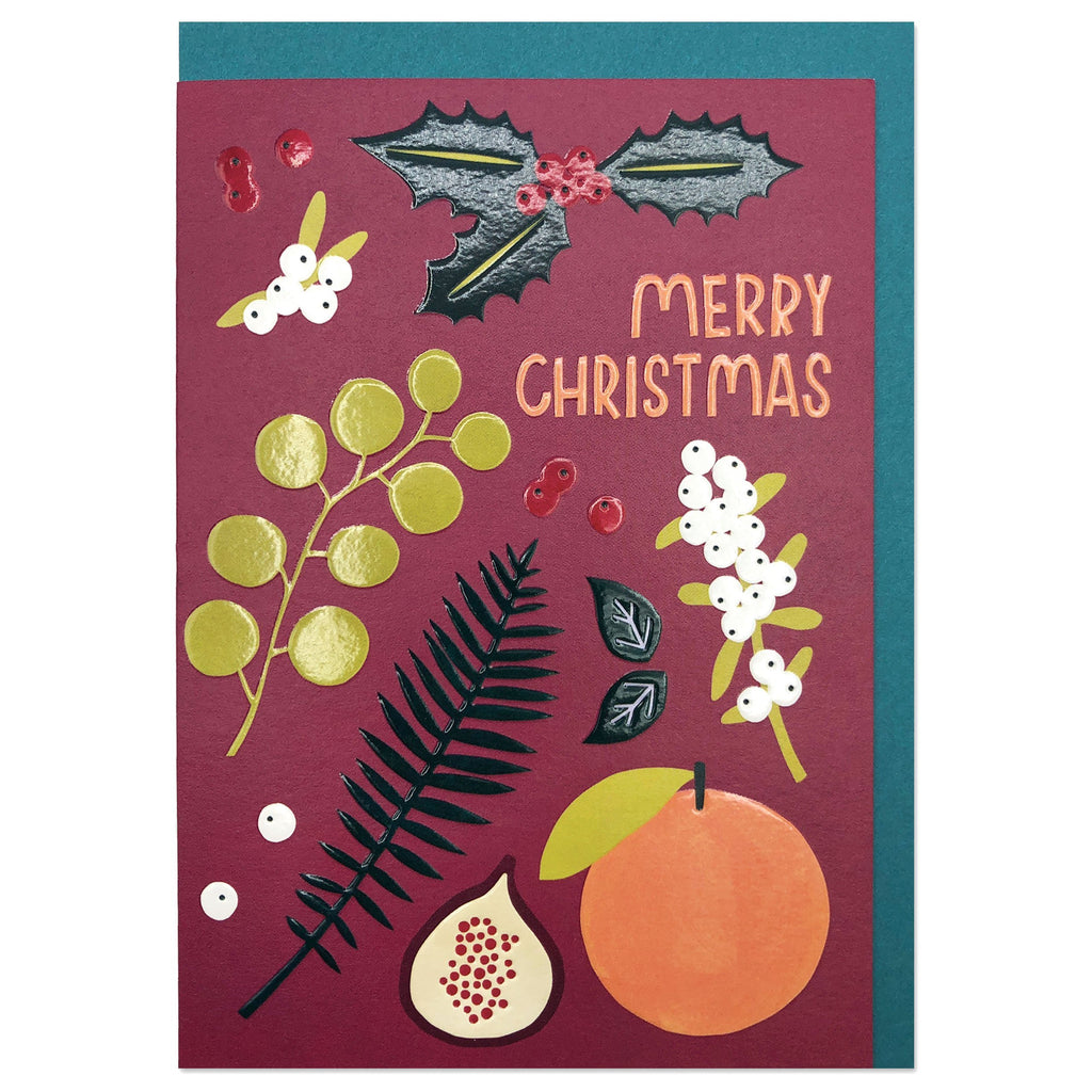 Card with 'Merry Christmas'. Deep burgundy background with a flatlay style layout. Bold graphic orange, pomegranate, mistletoe, fir, holly trig and berries.  