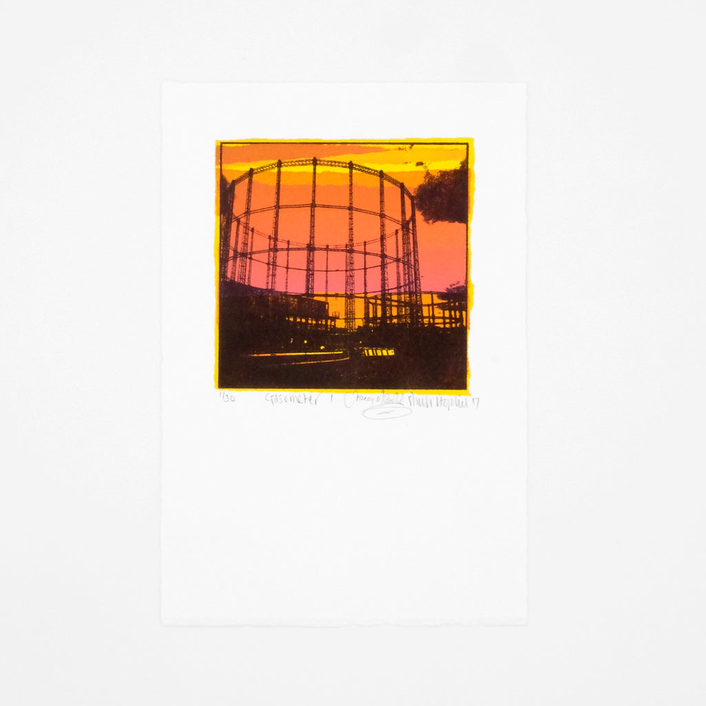 This is an image of a portrait oriented screenprint. The artwork is a square panel surrounded by a white border. It depicts the silhouette of a gasometere against an industrial background. The colours in the image are black, orange, yellow and deep peach. The artwork is signed and editioned. 