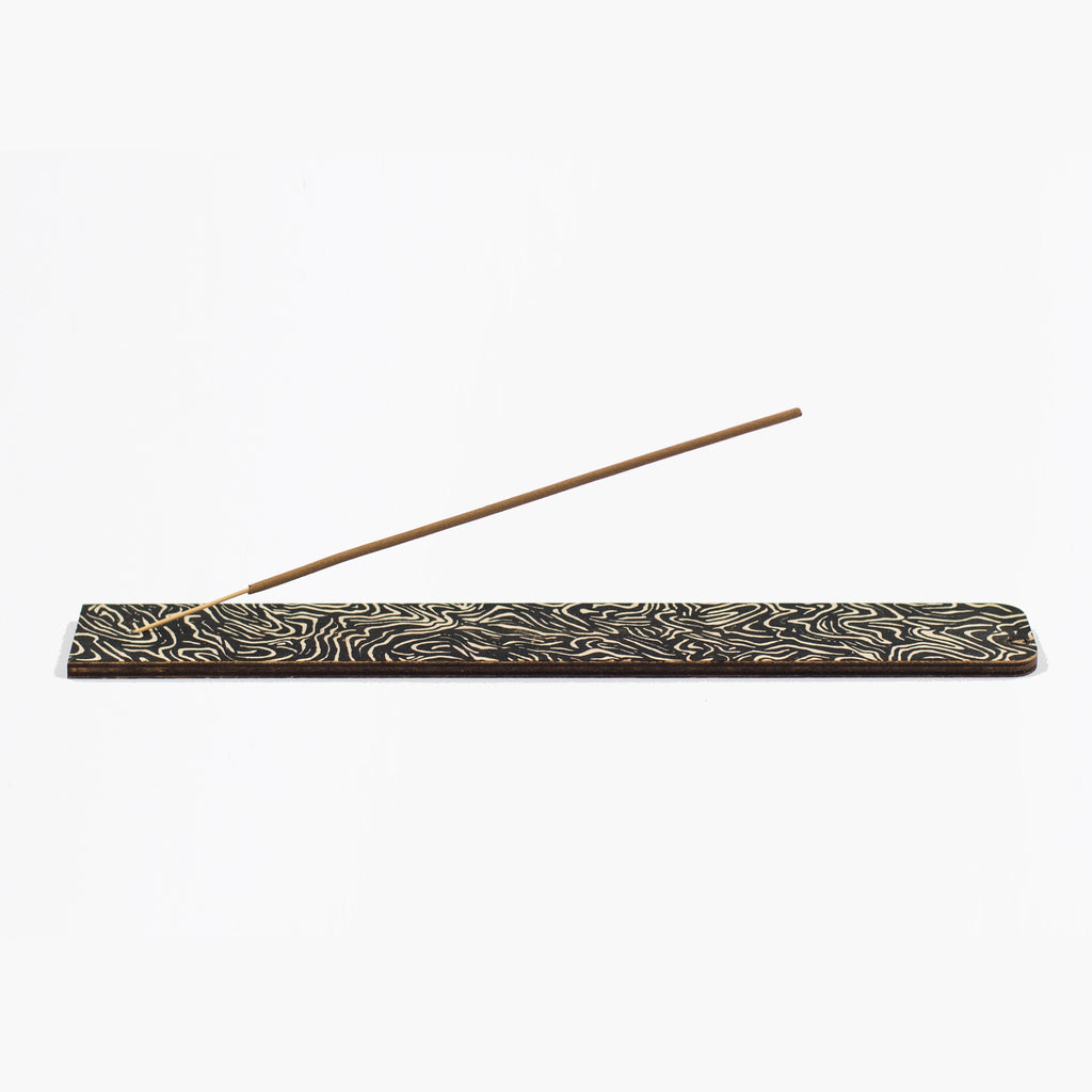 Black and white screen printed ply incense holder with 5 sandalwood incense sticks.