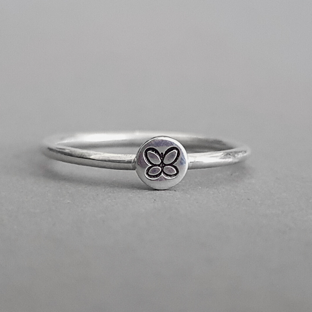Product image.  Sterling silver stacking ring with butterfly motif.