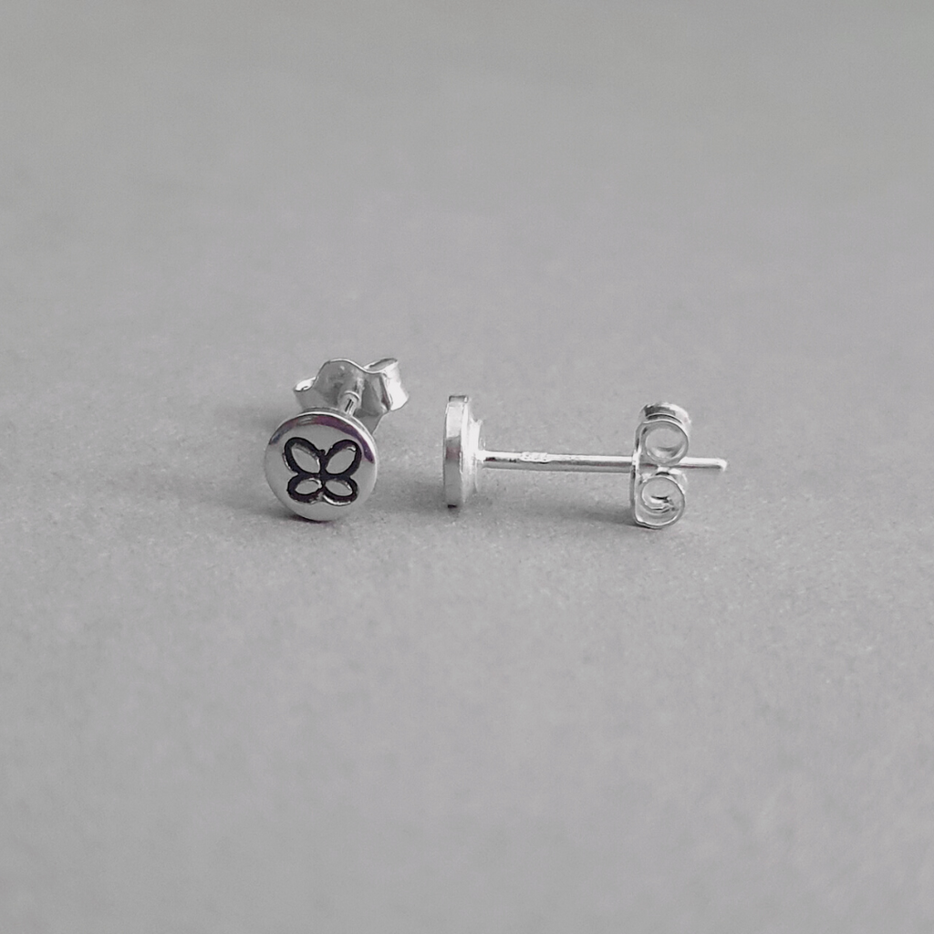 Product image.  Small sterling silver stud earrings with butterfly motif.