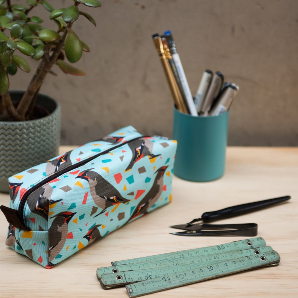 Graphic printed fabric pencil case with waxwing motif.