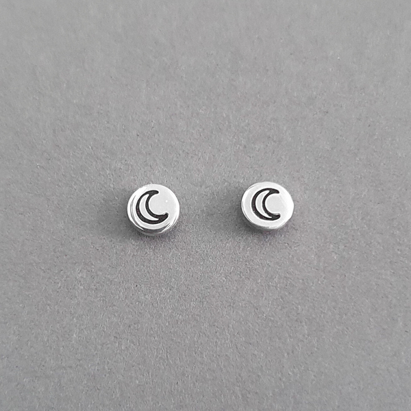 Product image.  Small sterling silver stud earrings with moon motif.
